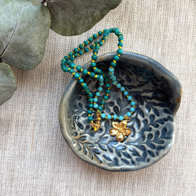 Turquoise Hand Knotted Necklace with Gold Flower Charm