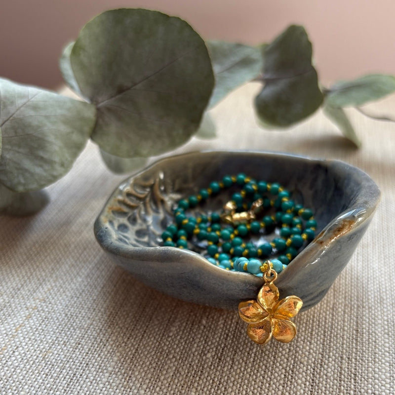 Turquoise Hand Knotted Necklace with Gold Flower Charm