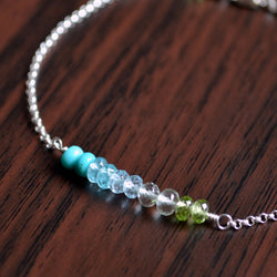 Silver Bracelet with Turquoise, Blue Topaz, and Peridot