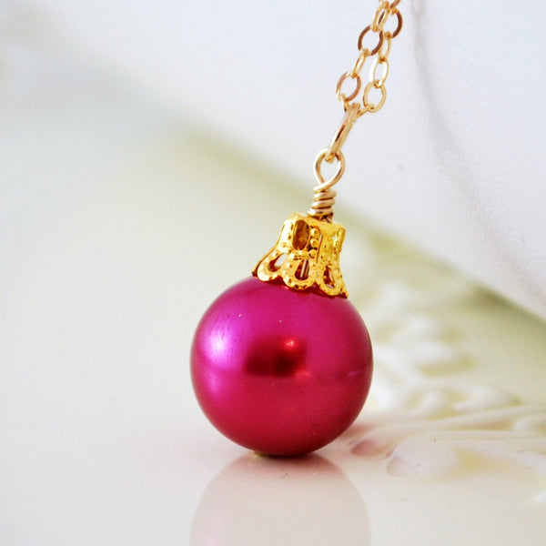 Fuchsia Necklace, Christmas Ball, and Glass Pearl